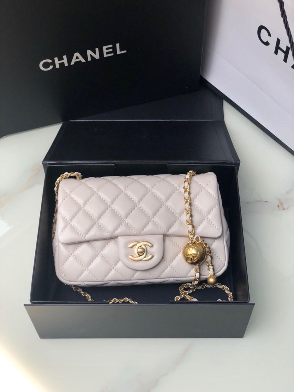 CHANEL Mini Quilted Flap Bag in Pale Pink with Gold Hardware
